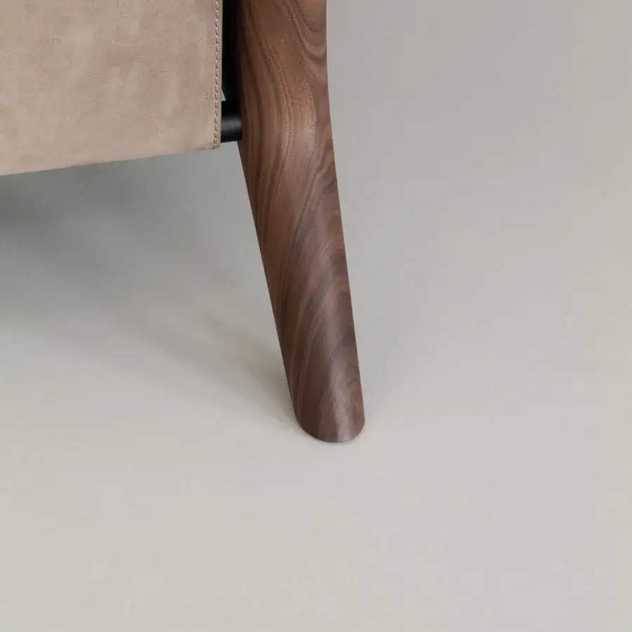 Distinguished Cierre1972 Iole lounge chair in light tan suede-like upholstery with a smooth, rich brown wood conical leg
