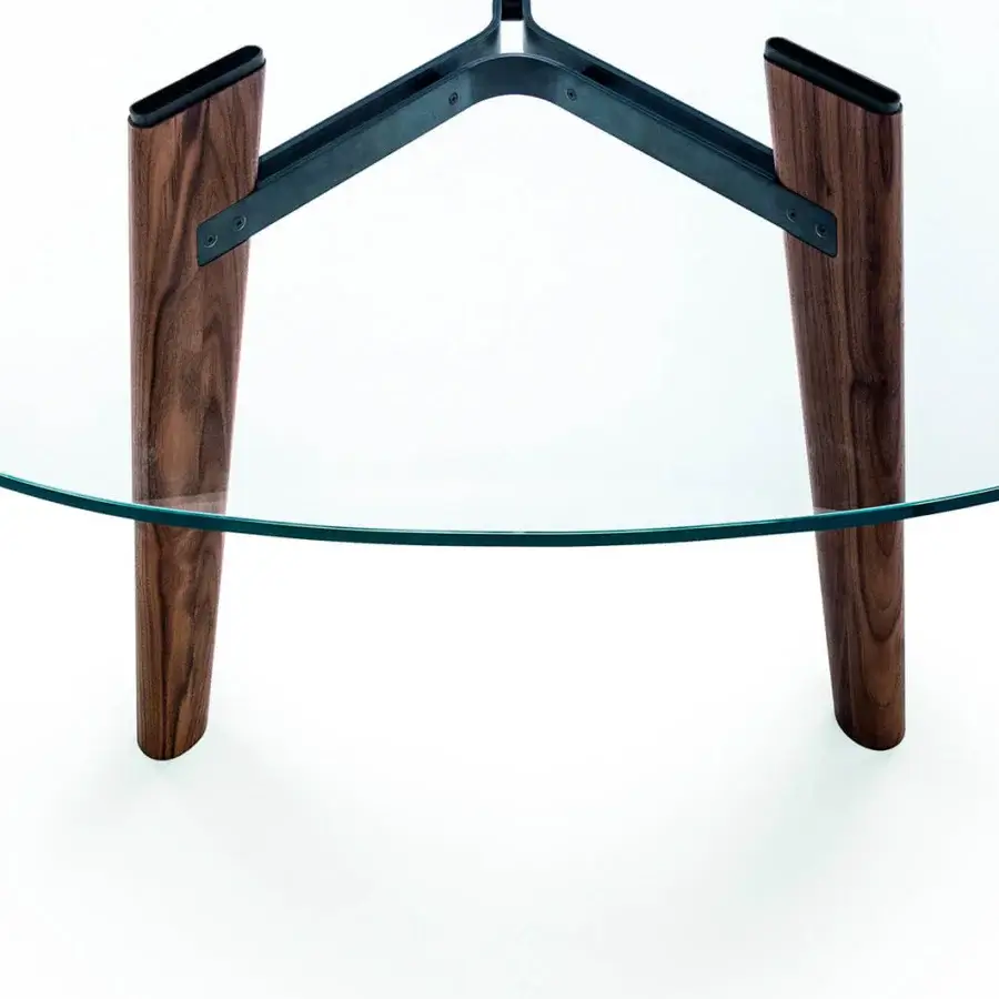 Superior Bross Beleos table with luxury extra clear glass and a dark wood base connected by bronze lacquered metal