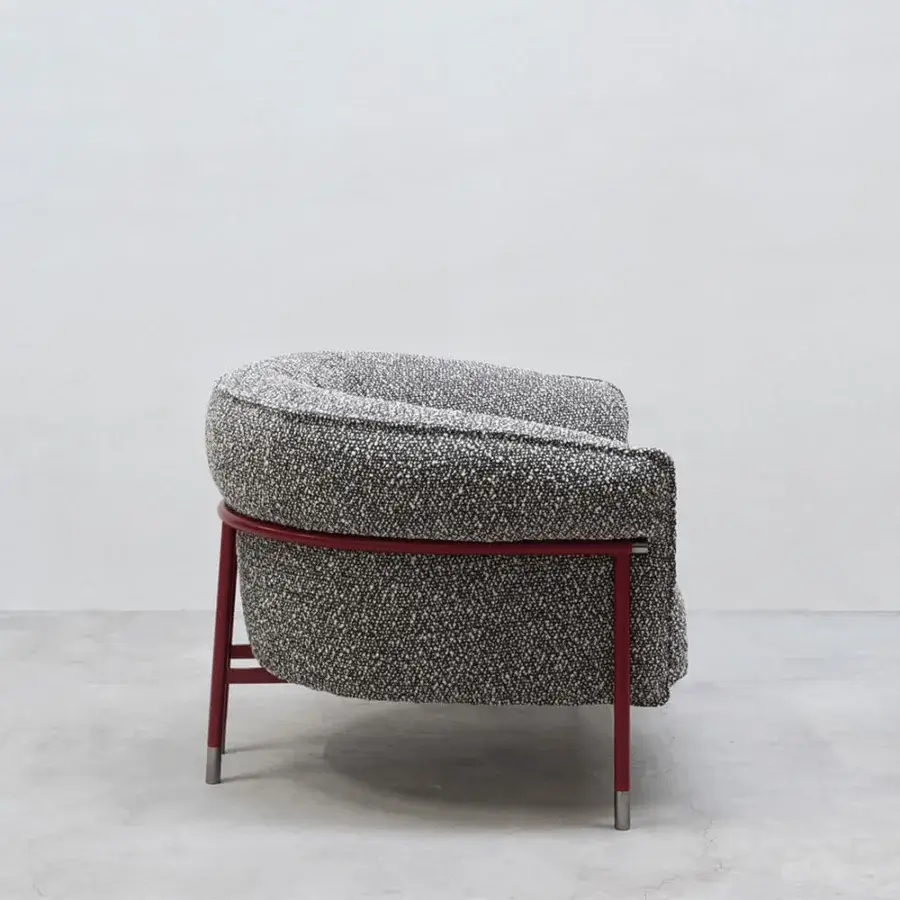 Distinguished Cierre1972 Mac lounge chair in mottled black, white, and gray textile with a matte red metal frame