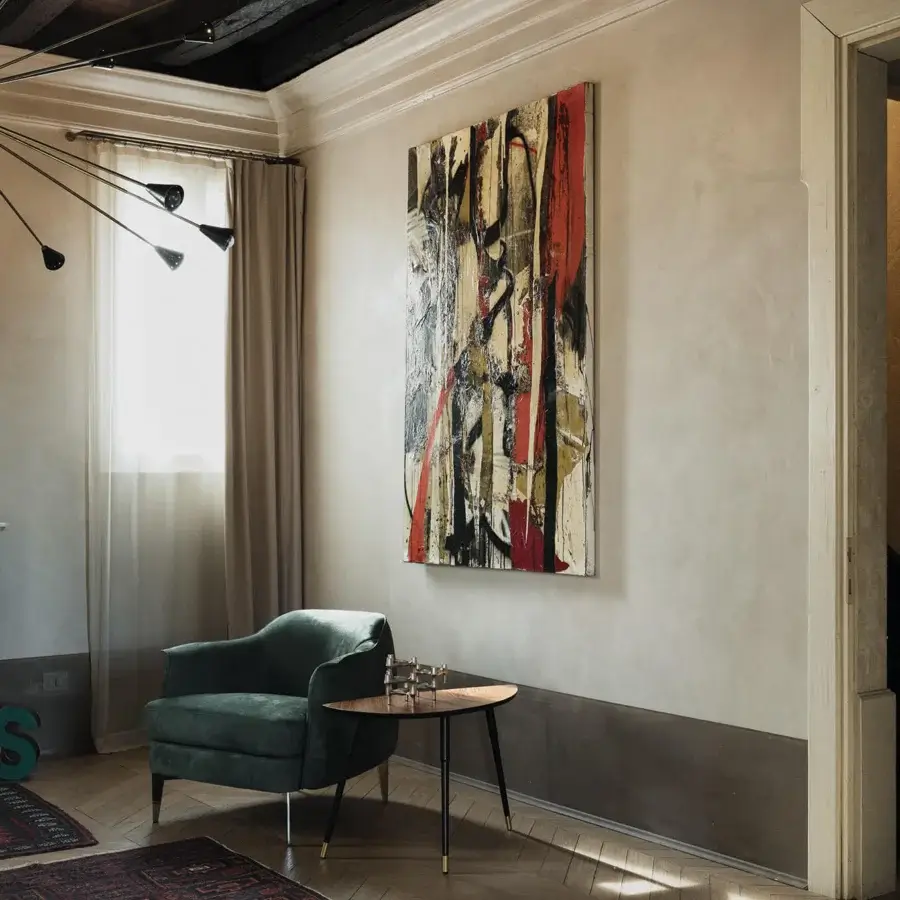 Elegant Cierre1972 Bohème lounge chair with dark green textile upholstery and gold-tipped metal legs