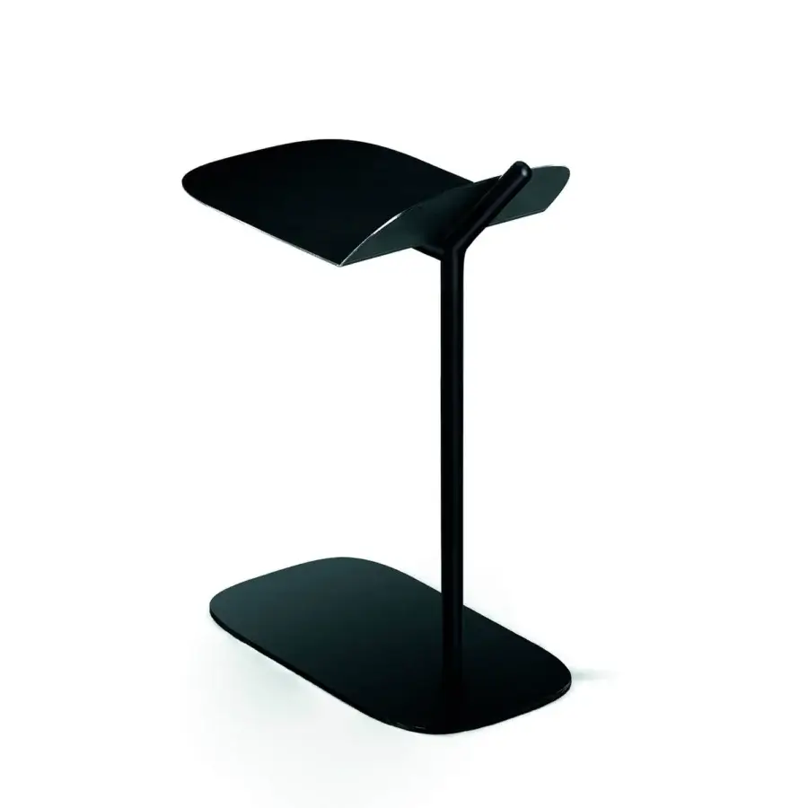 Distinguished Bross Wam side table in black metal with lacquer, exhibiting an asymmetrical tabletop and sleek silhouette