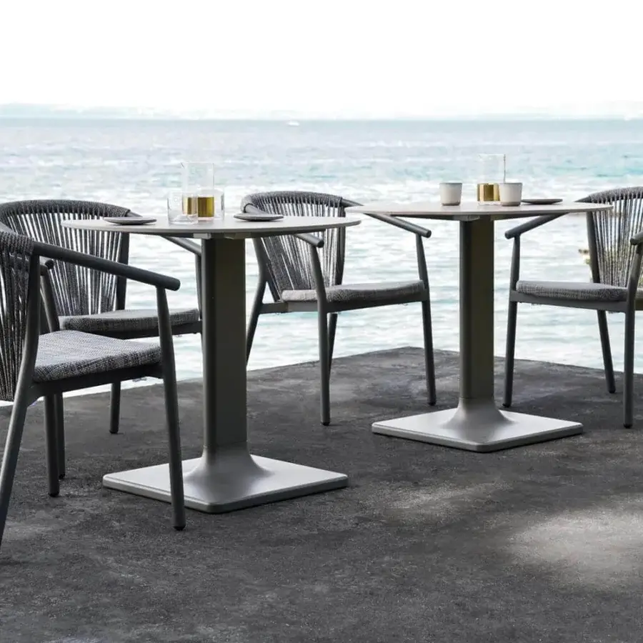 Elegant Varaschin Smart armchair with dark-toned VAR#TEX PVC mesh and powder-coated aluminum structure