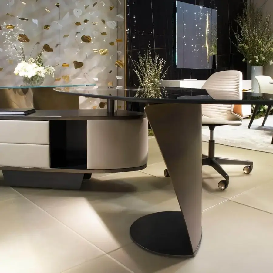 Distinguished Reflex Vele desk with shaped Marble glass and bronze finished metal built with a light cream leather drawer unit