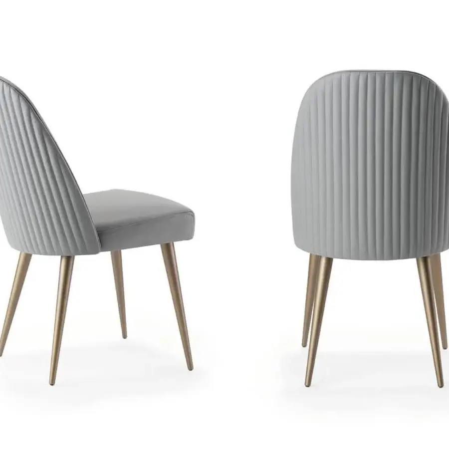 Elegant Reflex Ludwig chair with light gray textile upholstery and glossy golden metal legs