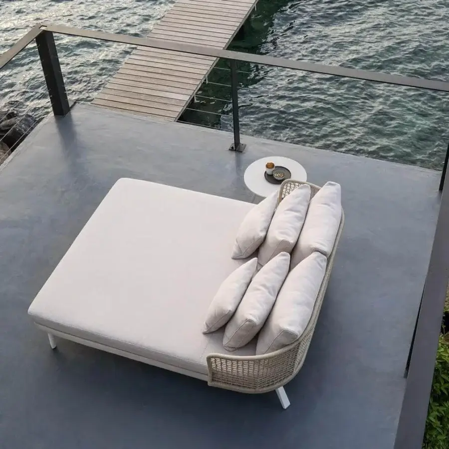 Distinguished Varaschin Emma lounger with refined aluminum legs and light beige fabric upholstery crafted with Dryfeel outdoor foam