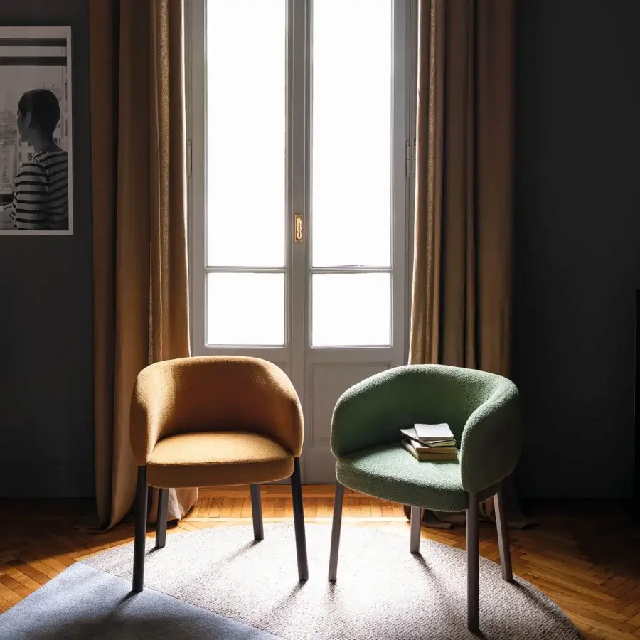Exceptional Bross Aretha armchair crafted in golden-brown fabric with dark-toned wood legs and a curved silhouette