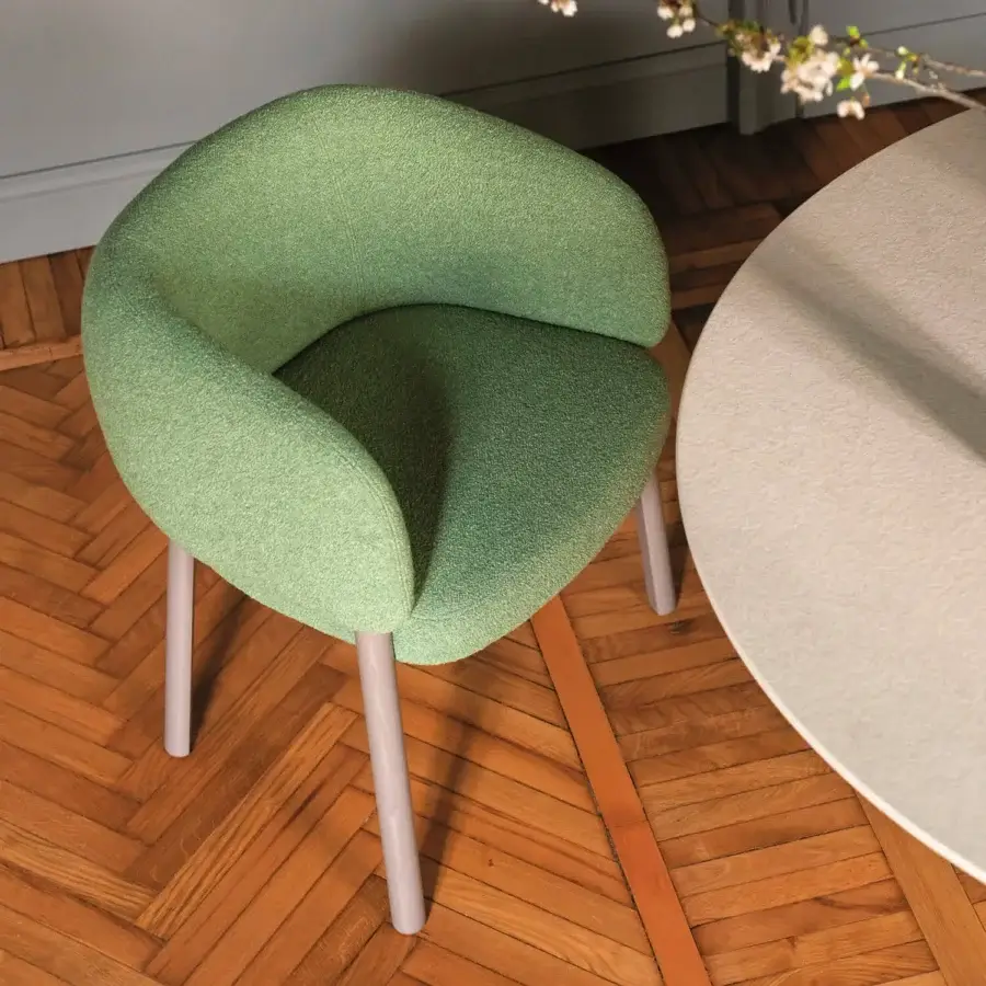 Elegant Bross Aretha armchair upholstered in light green fabric with cylindrical matte light gray lacquered legs
