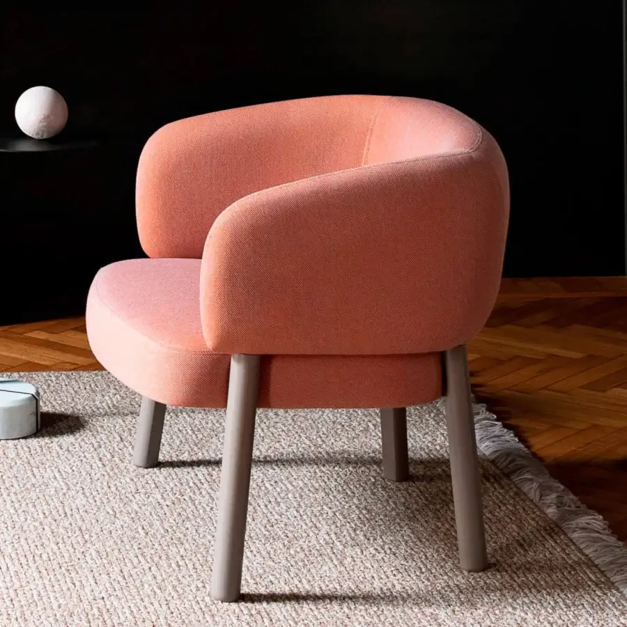 Exceptional Bross Aretha lounge chair with coral subtly textured fabric and sleek gray-toned wood legs