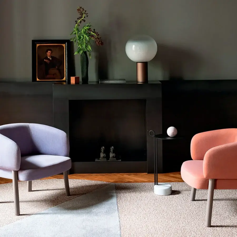 Distinguished Bross Aretha lounge chair upholstered in light lavender textile with matte cylindrical wood legs