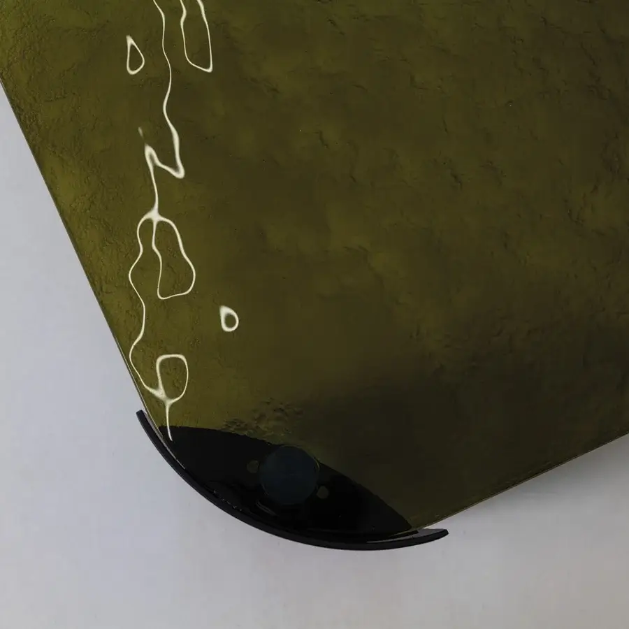Captivating Cierre1972 Riviera coffee table with rounded glass top and curved base crafted in dark olive textured glass