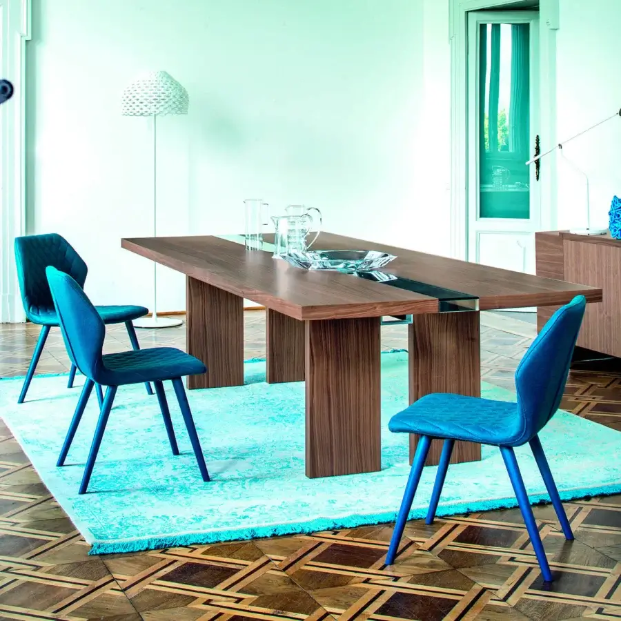 Exclusive Bross Ava chair with blue quilted textile and glossy wood-covered metal legs crafted in Italy