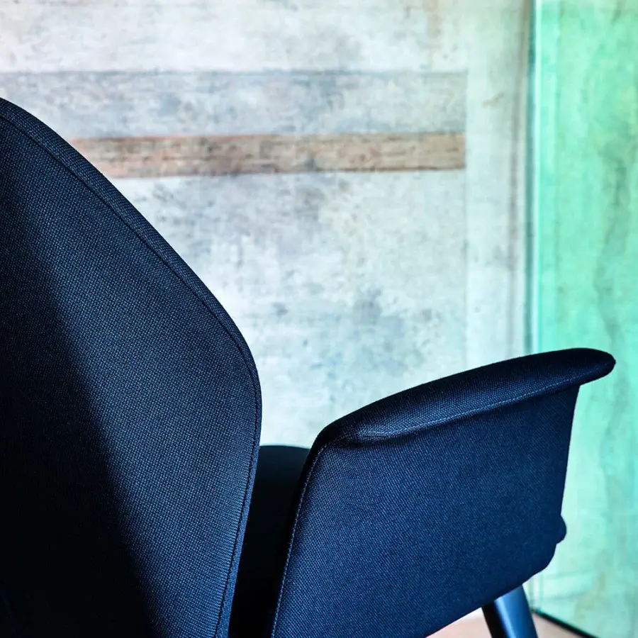Distinguished Bross Ava lounge chair with dark woven textile upholstery and angled dark metal legs