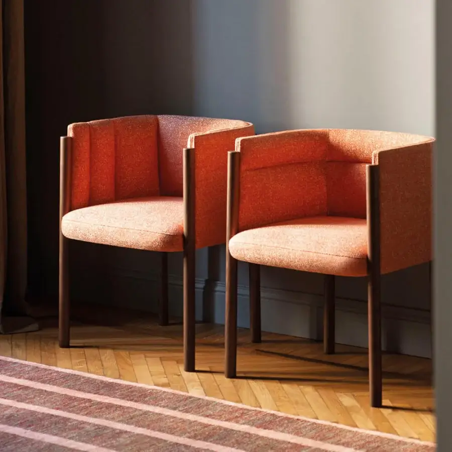 Superior Bross Baia armchair with speckled orange quilted fabric and dark brown matte-finished wood legs