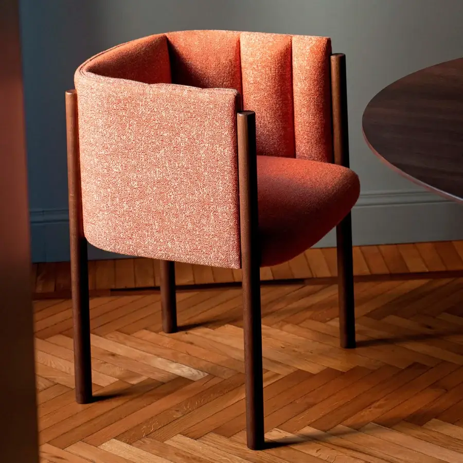 Lavish Bross Baia armchair crafted in Italy with textured coral fabric, quilted detailing and matte dark brown wood legs