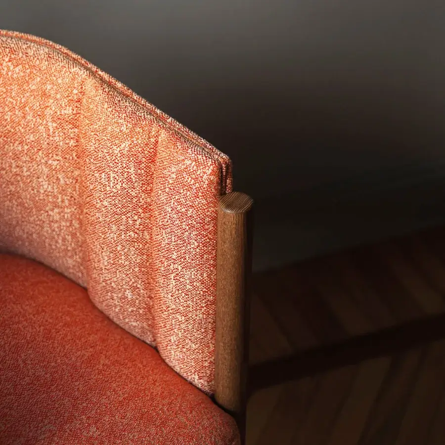 Superior Bross Baia armchair in reddish-orange textured fabric with quilted front and curved wooden legs crafted in Italy