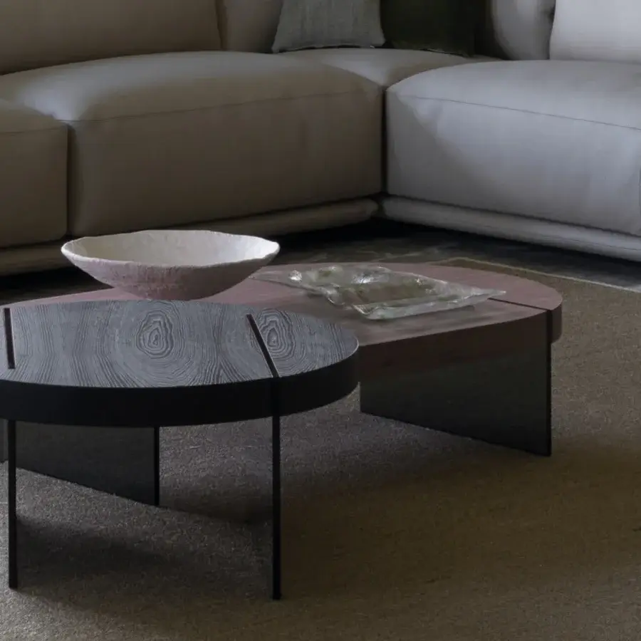 Elegant Cierre1972 Byron coffee table with a dark round tabletop and sleek panel legs crafted in wood
