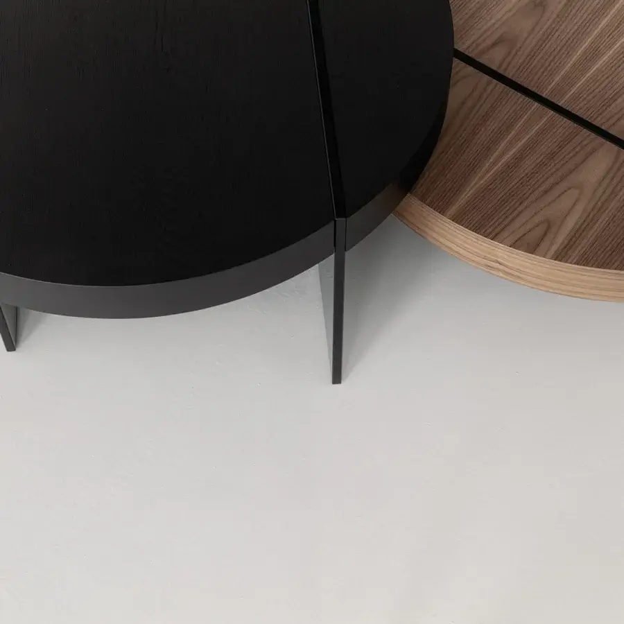 Distinguished Cierre1972 Byron coffee table with round black wood top and subtly angled legs in matte finish
