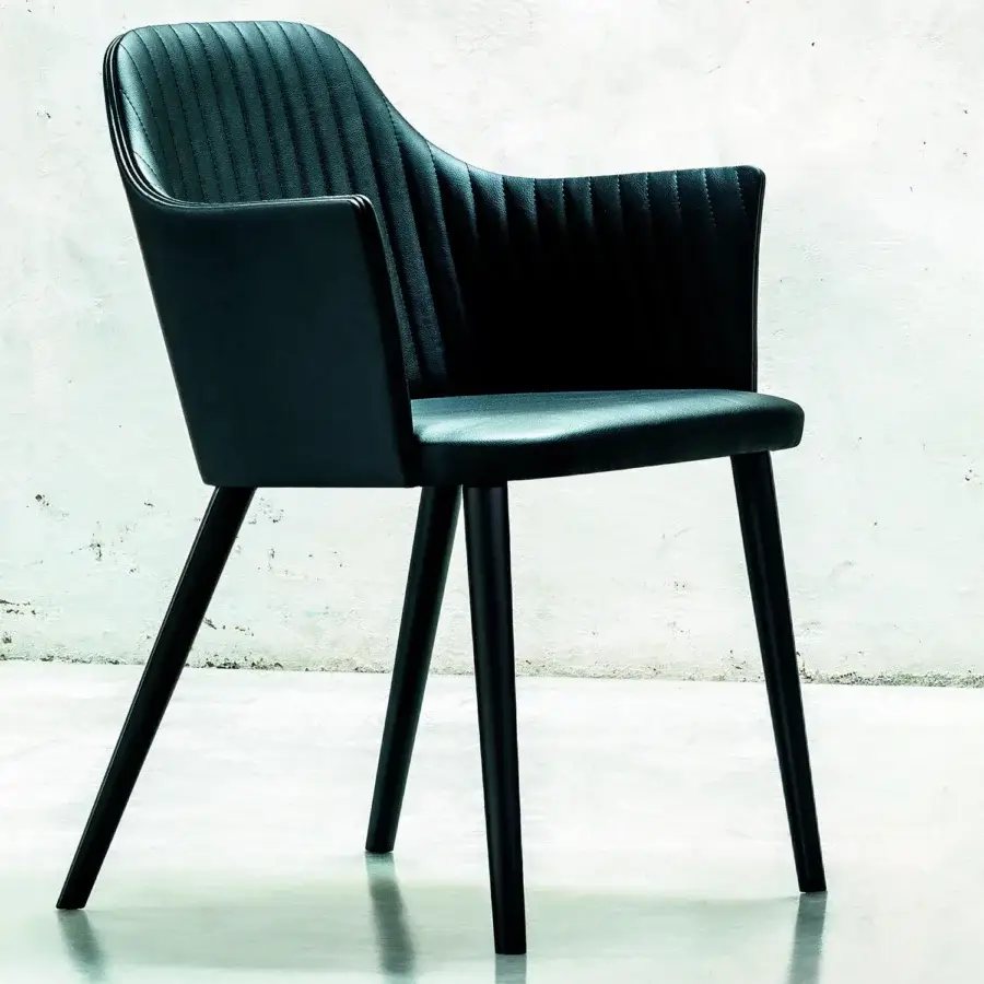 Distinguished Bross Break armchair upholstered in premium black fabric with lacquered black wood legs and vertical stitches