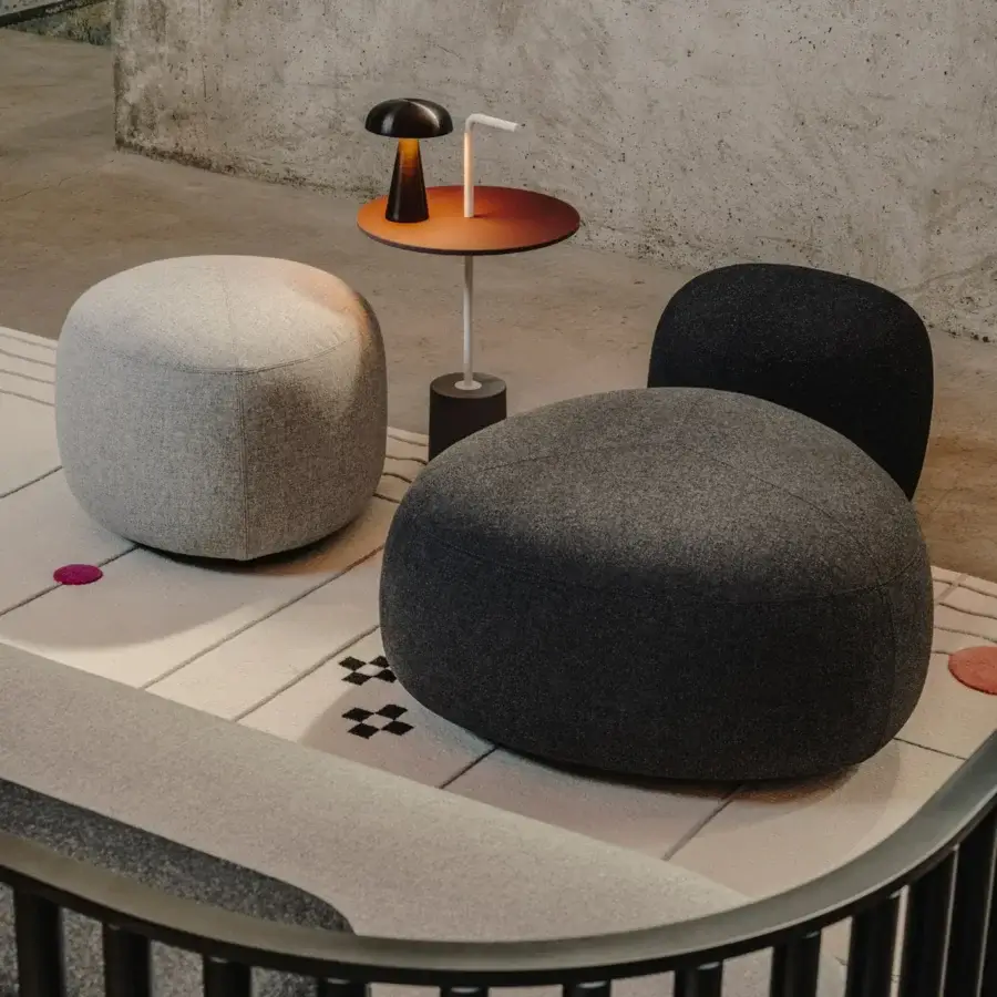 Distinguished Lapalma Kipu ottoman with soft rounded form upholstered in matte light gray textile and plywood base