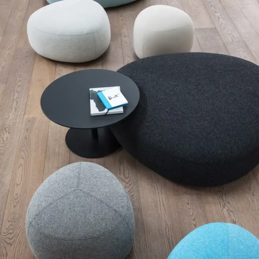 Exclusive Lapalma Kipu ottoman crafted in light blue textile with rounded triangular form and matte finish