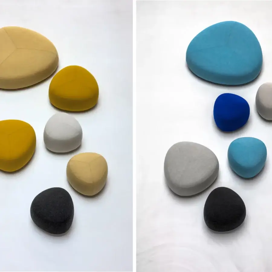 Superior Lapalma Kipu ottoman showcases a segmented pebble shape upholstered in yellow, beige, gray and black textile with a smooth matte finish