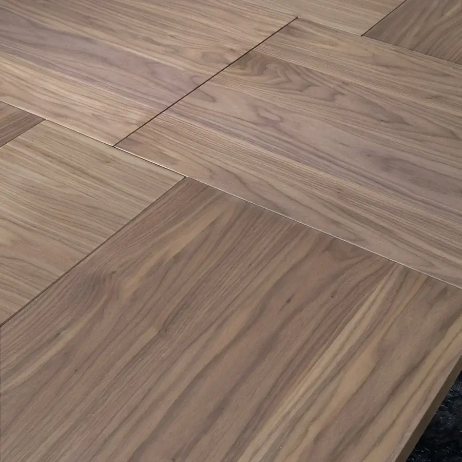 Exclusive Ozzio Italia 4x4 table with a medium brown wooden top and matte finish showcasing tonal variations