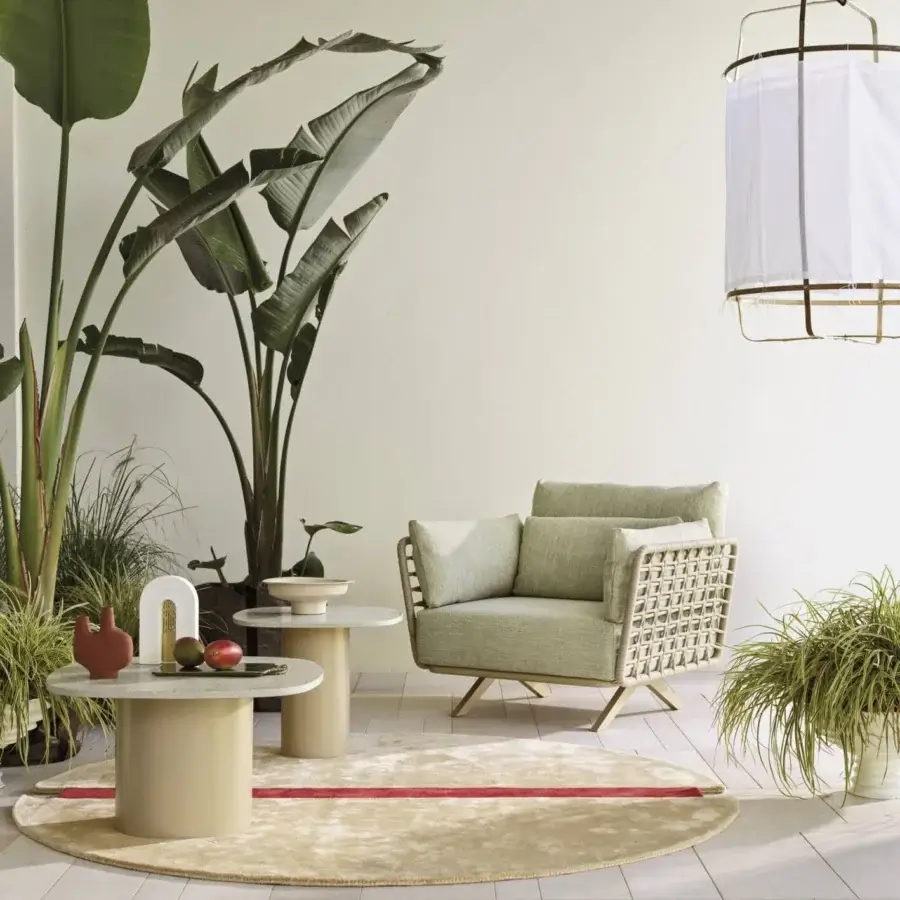 Distinguished Roberti Rànan lounge chair with stainless steel and aluminum frame woven in Oval Trendyrope with light green fabric
