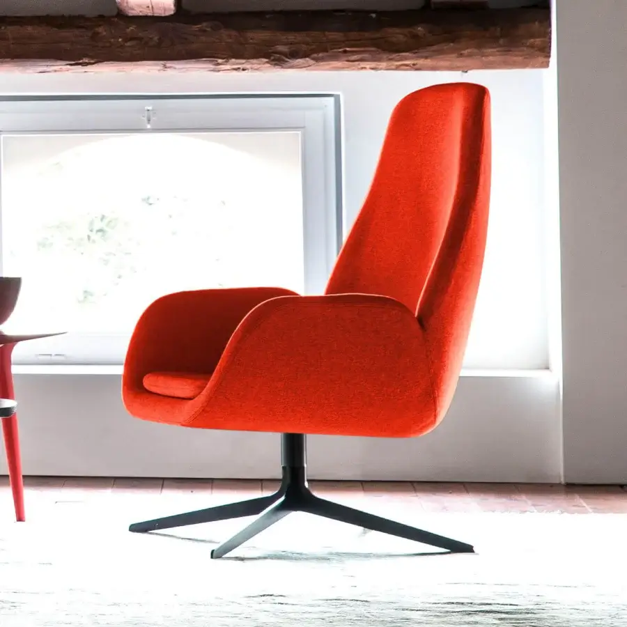Superior Bross Mysa lounge chair in vibrant orange premium fabric with a black lacquered metal four-star base
