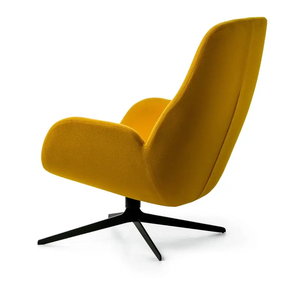 Captivating Bross Mysa lounge chair with organic silhouette upholstered in mustard-yellow textile and matte black lacquered metal base