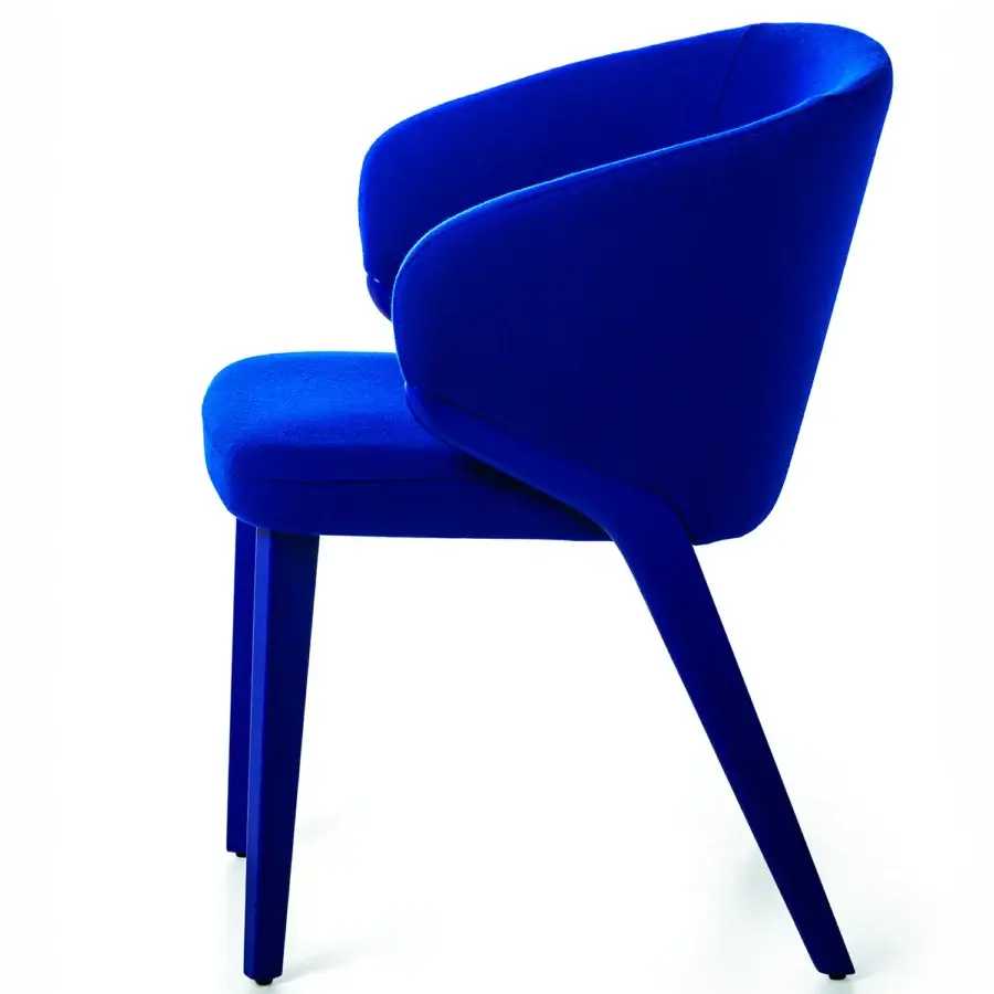 Exceptional Bross Nora armchair with enveloping curved form fully upholstered in vibrant blue textured fabric and high-end wood structure