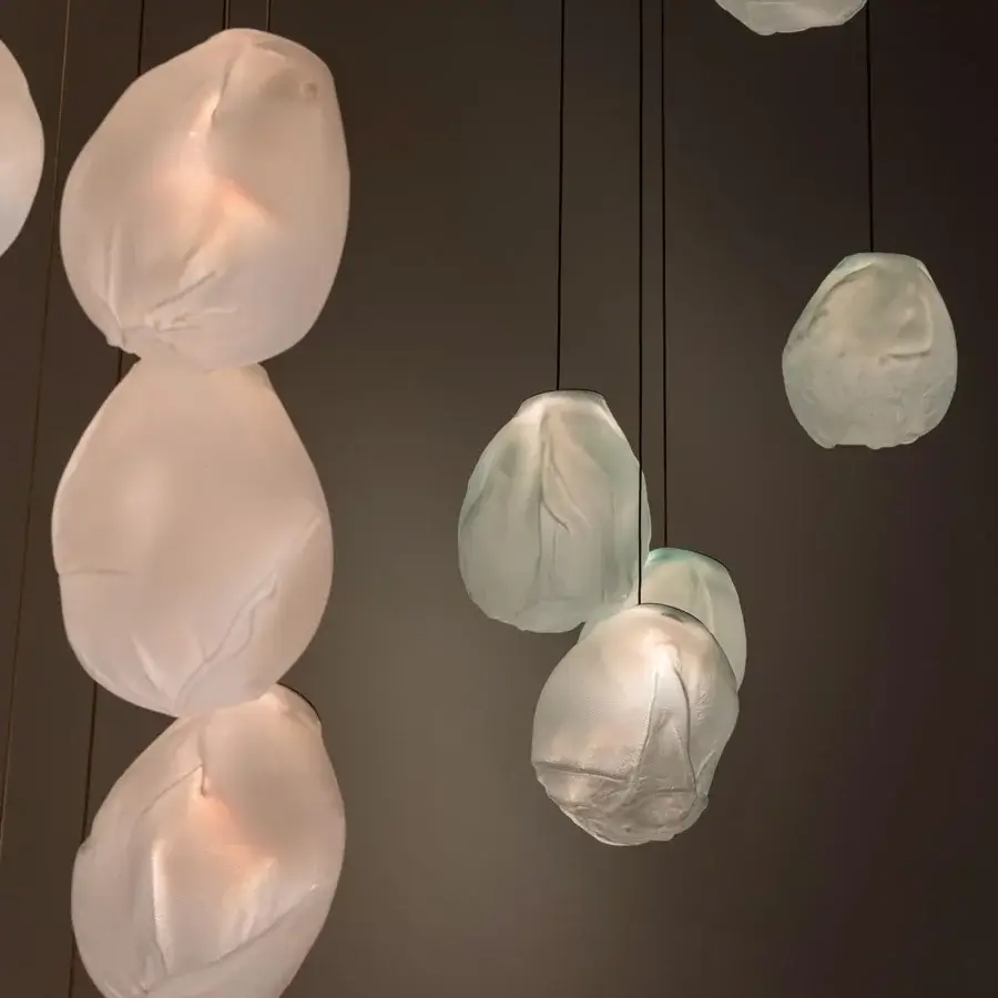 Exceptional Bocci 73V lamp suspension crafted with translucent matte white glass diffusers and braided metal cables
