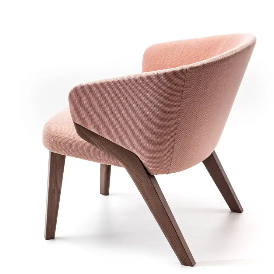 Elegant Bross Nora lounge chair with muted pink textured fabric upholstery and dark brown matte wood structure