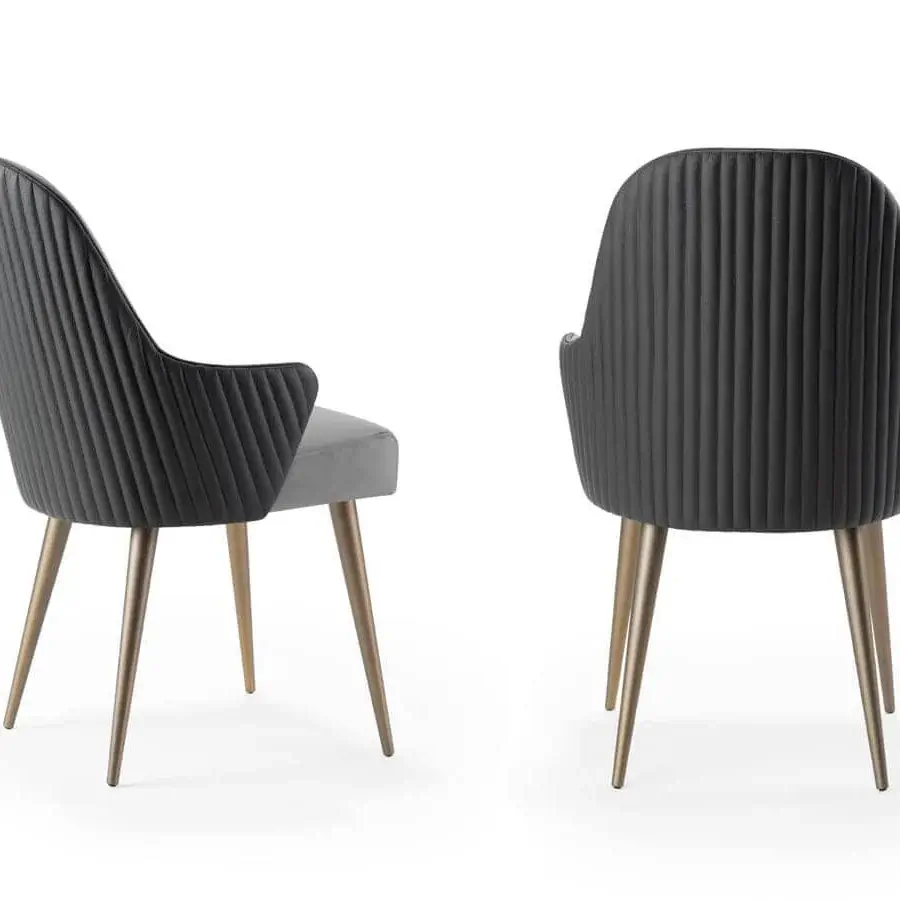 Elegant Reflex Ludwig chair upholstered in contrasting dark and light gray textiles with golden metal legs
