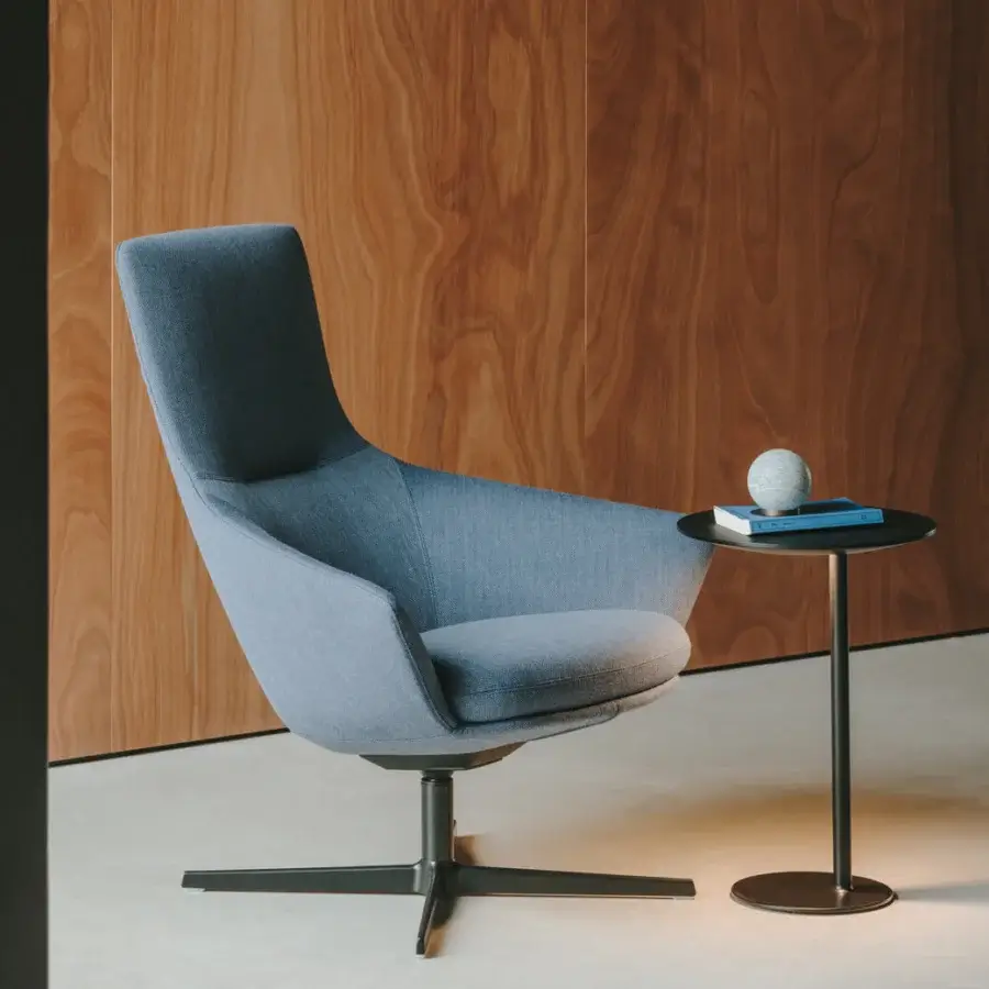 Distinguished Lapalma Wing Tip lounge chair with light blue upholstered shell and powder-coated aluminum swivel base