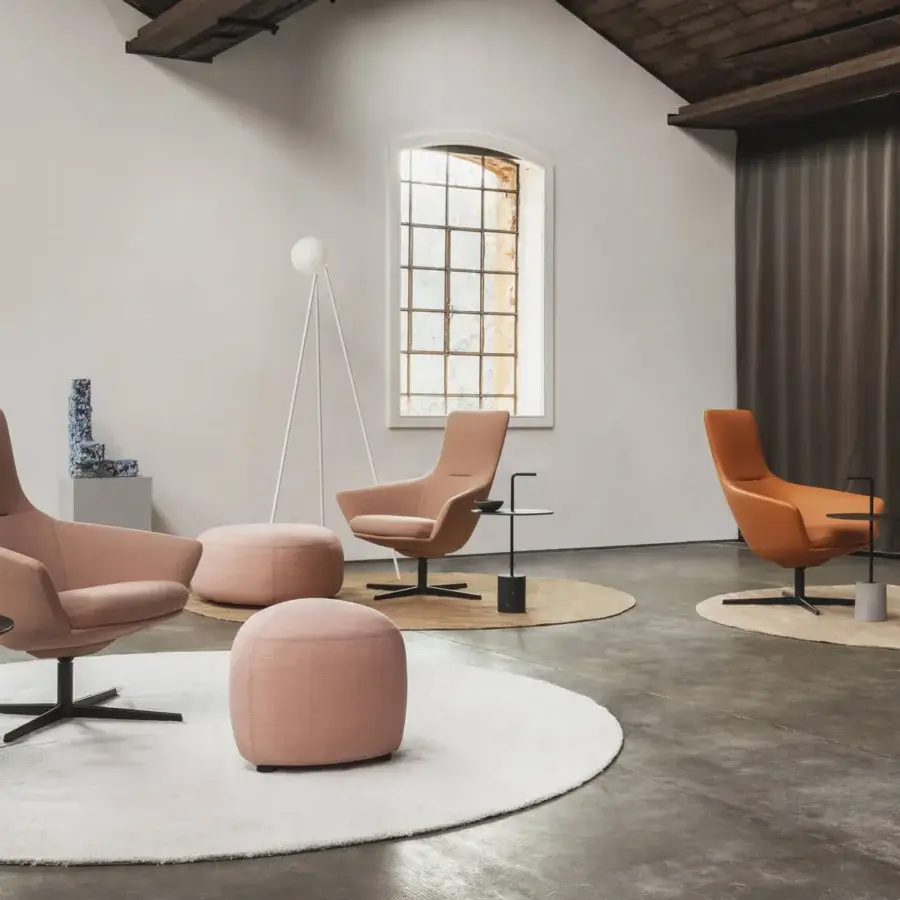 Distinguished Lapalma Wing Tip lounge chair with reddish-brown textile upholstery and sleek matte black powder-coated aluminum base