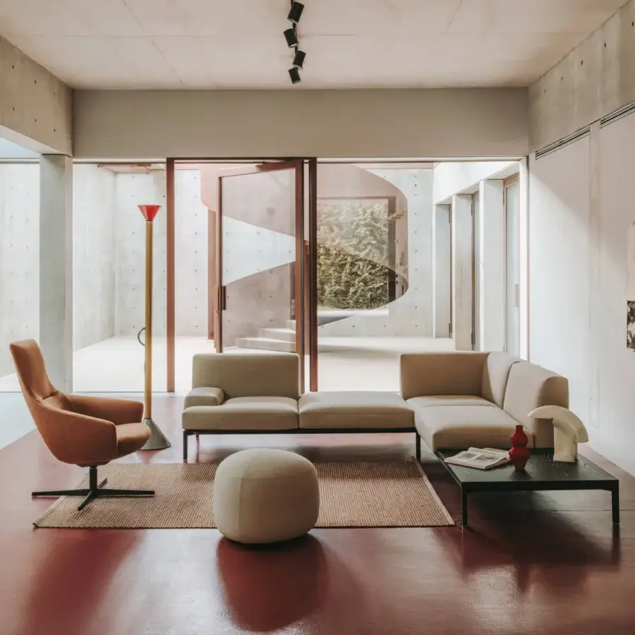 Elegant Lapalma Wing Tip lounge chair with warm light-brown textile upholstery and sleek black powder-coated aluminum base