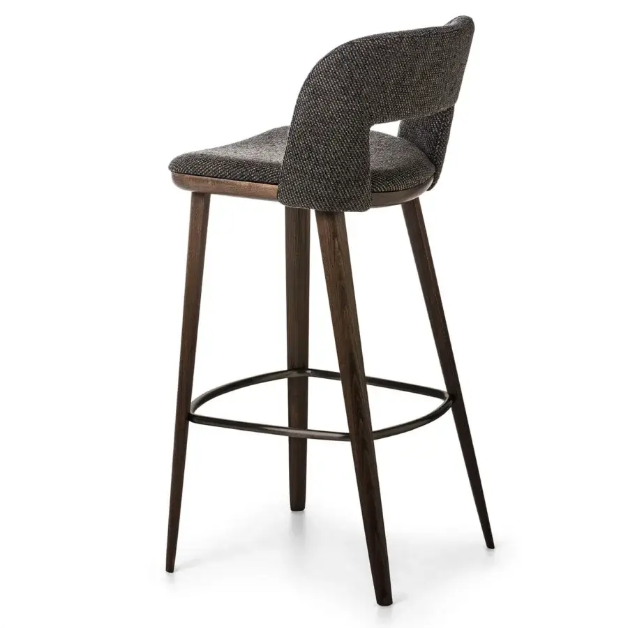 Distinguished Bross Path stool with textured gray and brown fabric upholstery and dark brown wood legs with a metal footrest