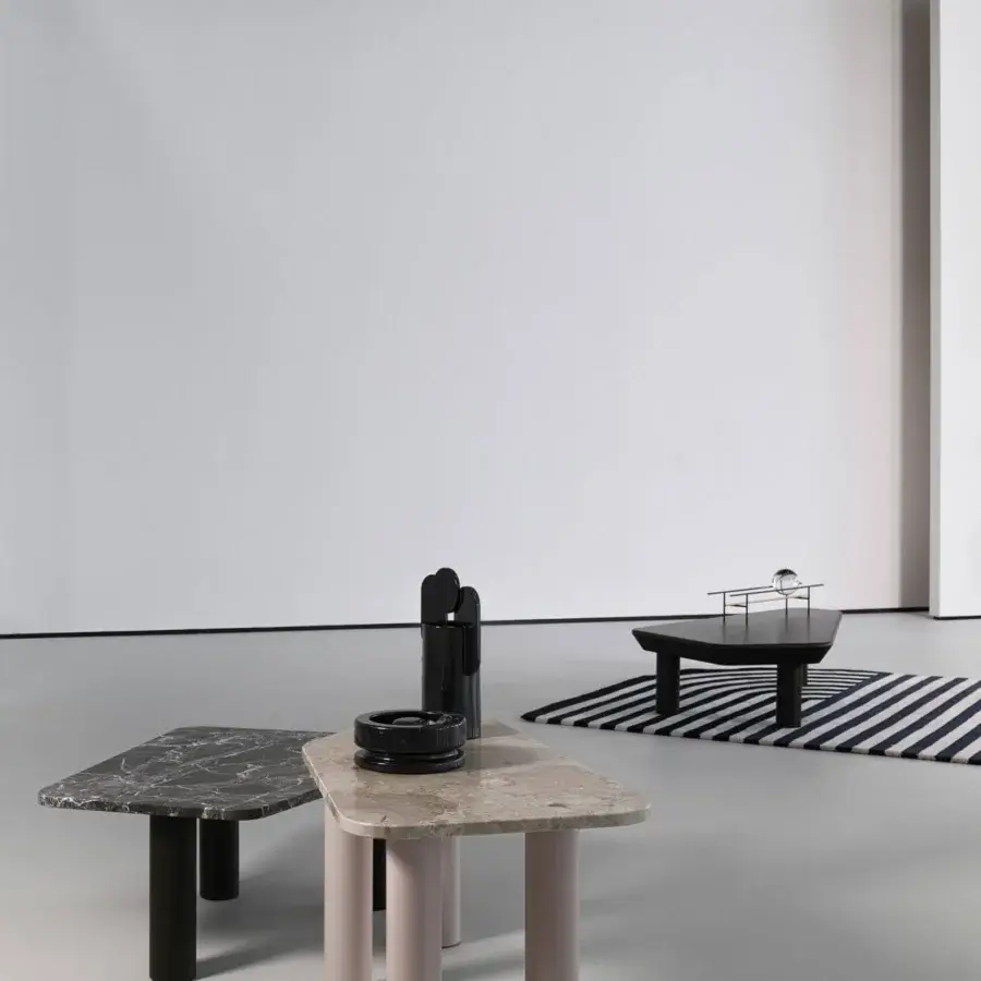 Captivating Cierre1972 Iceberg coffee table with a black matte wood top and cylindrical legs supporting a glass sphere