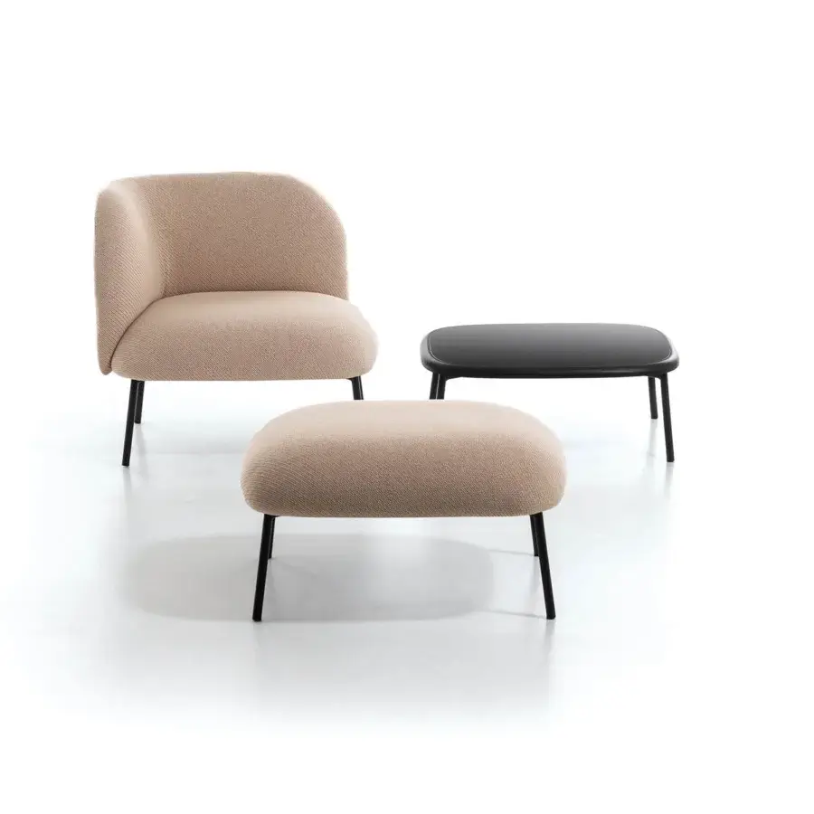 Elegant Bross Sit ottoman with light beige premium fabric and slender dark metal legs crafted in Italy