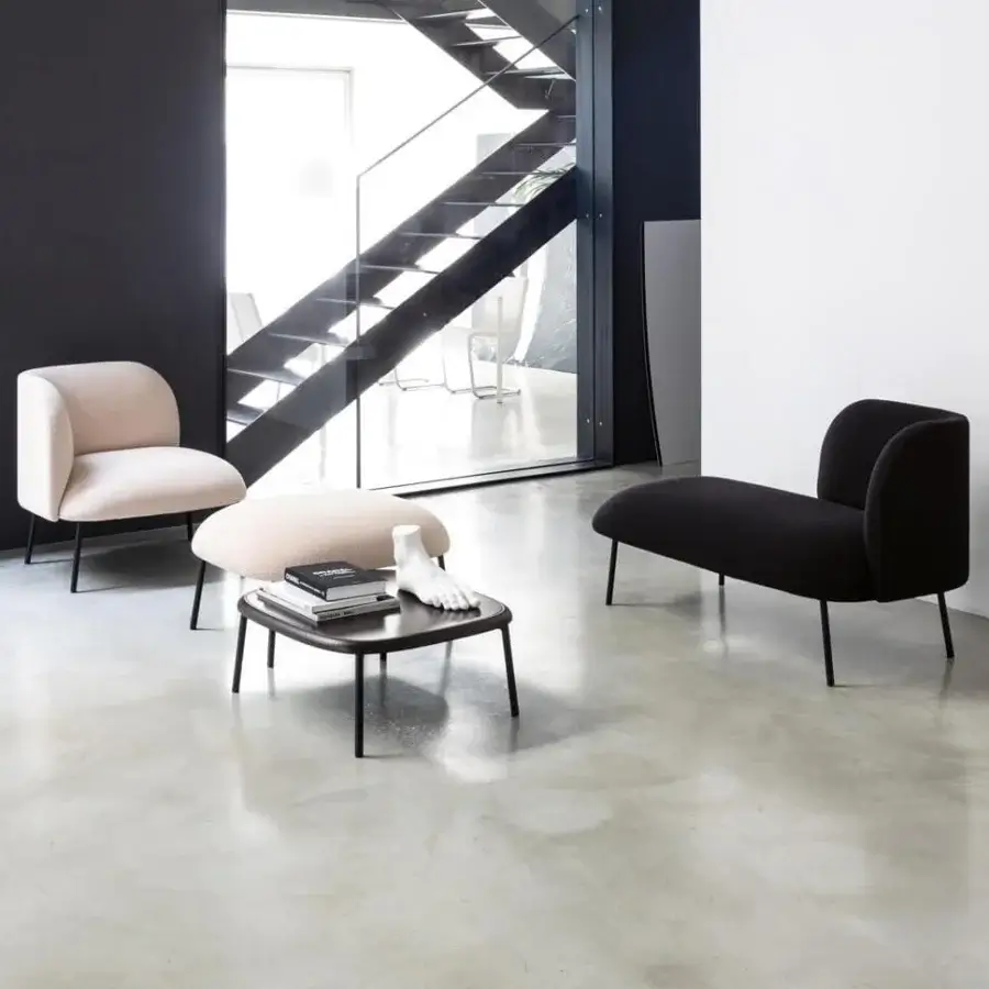 Distinguished Bross Sit lounge chair with fully upholstered black fabric and sleek curved metal legs