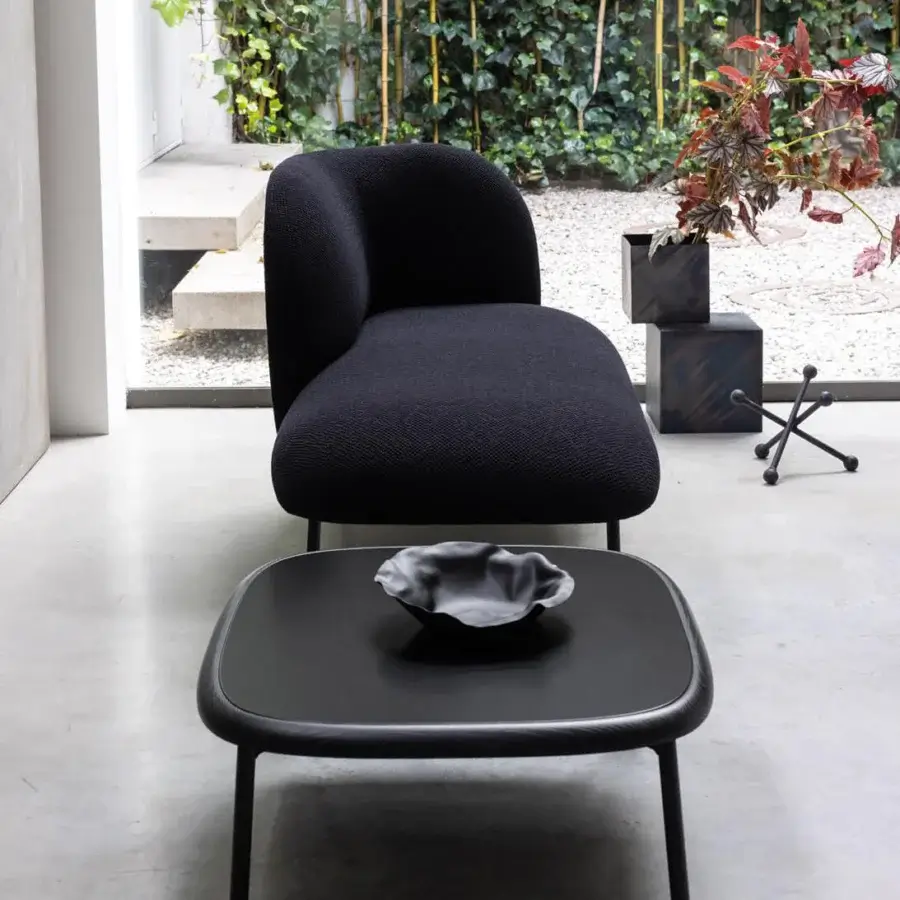 Elegant Bross Sit chaise lounge crafted in dark textured textile with sleek metal legs for contemporary style