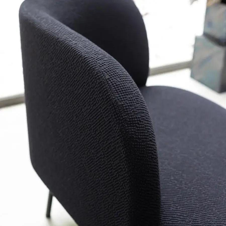 Superior Bross Sit chaise lounge crafted in Italy with dark textured textile upholstery and a sleek metal frame