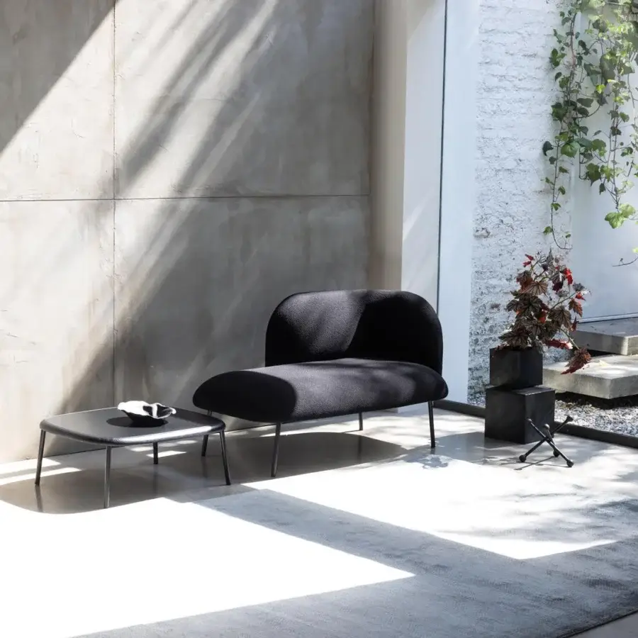 Distinguished Bross Sit chaise lounge crafted in matte black premium fabric with a sleek metal frame