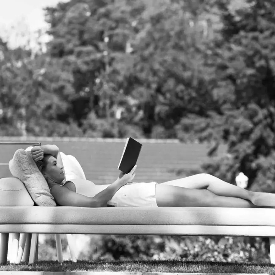 Distinguished Varaschin Emma lounger with iroko wood legs and high-end fabric upholstery in a light matte finish