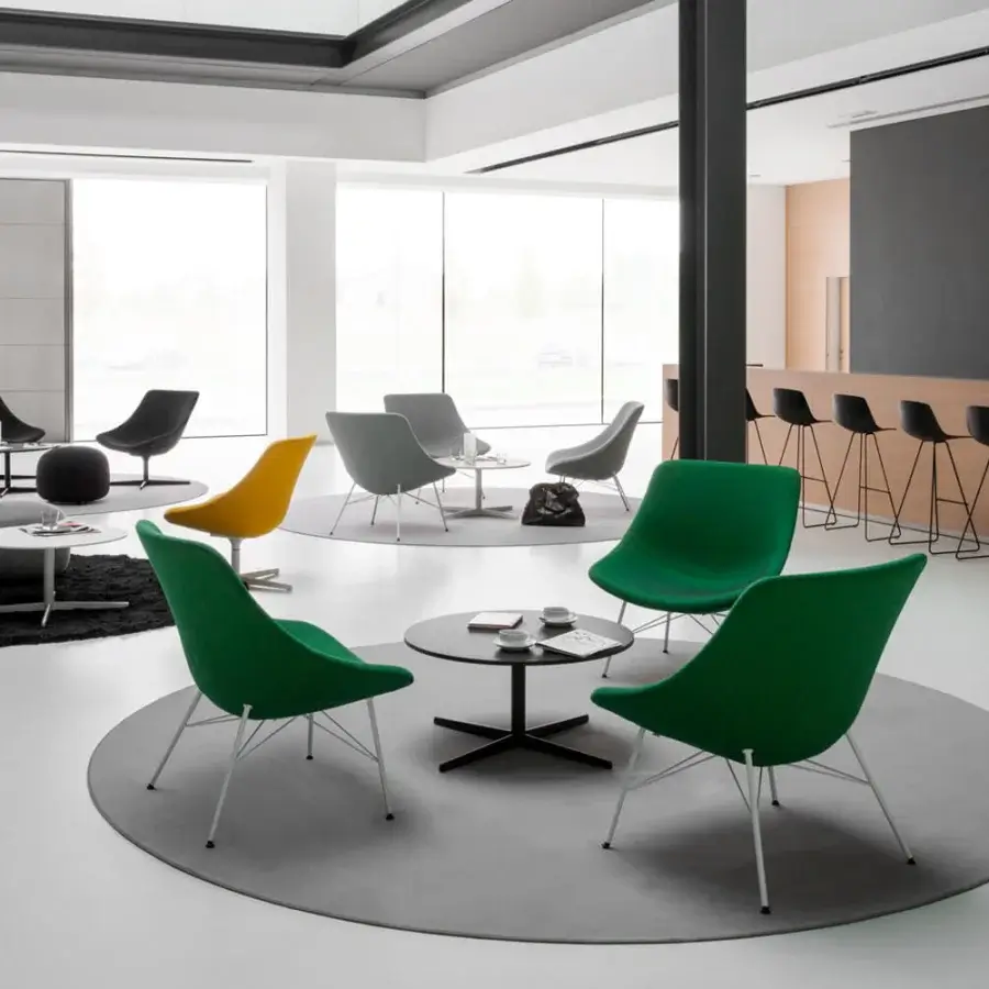 Distinguished Lapalma Auki coffee table with a round dark laminate top and dark powder-coated steel four-star base