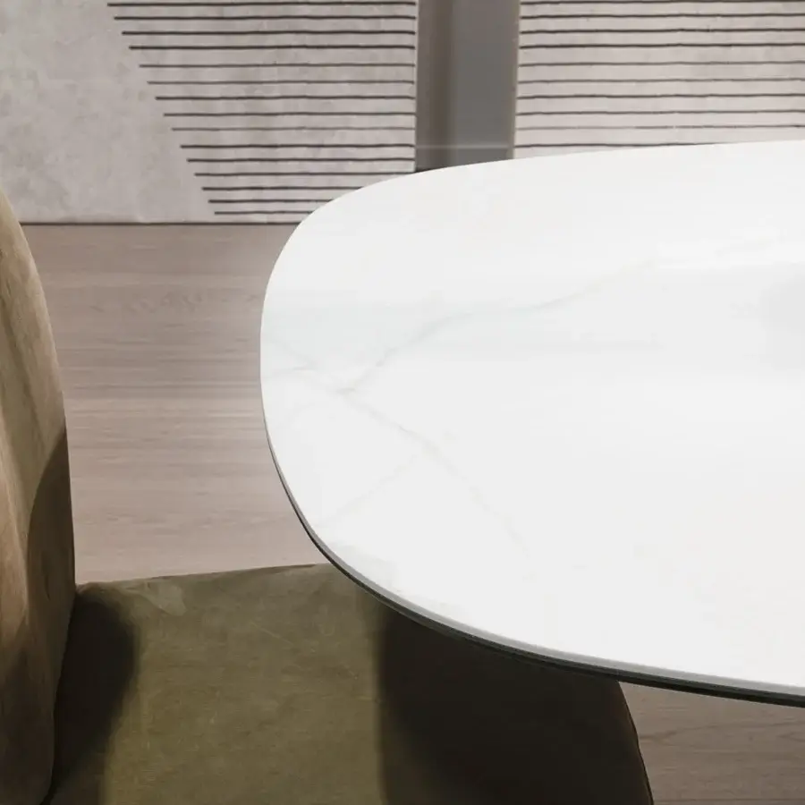 Superior Cierre1972 Wings table with a white marble-like ceramic top and wing-shaped legs covered in printed Leather