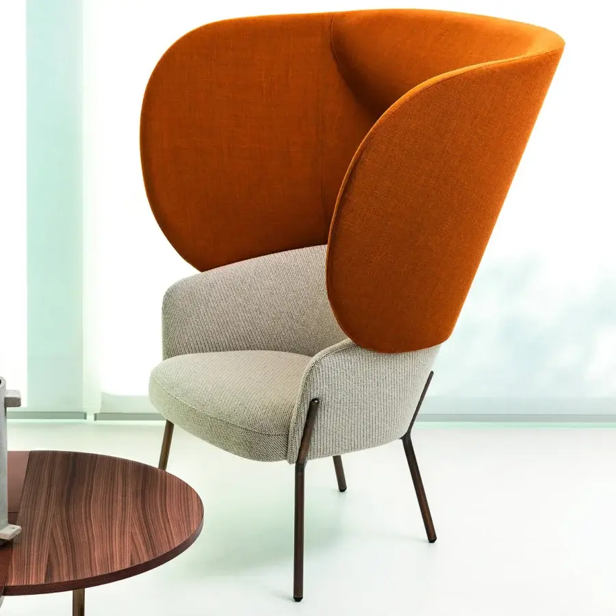 Distinctive Bross Wam lounge chair upholstered in textured light gray premium fabric with slender metal legs