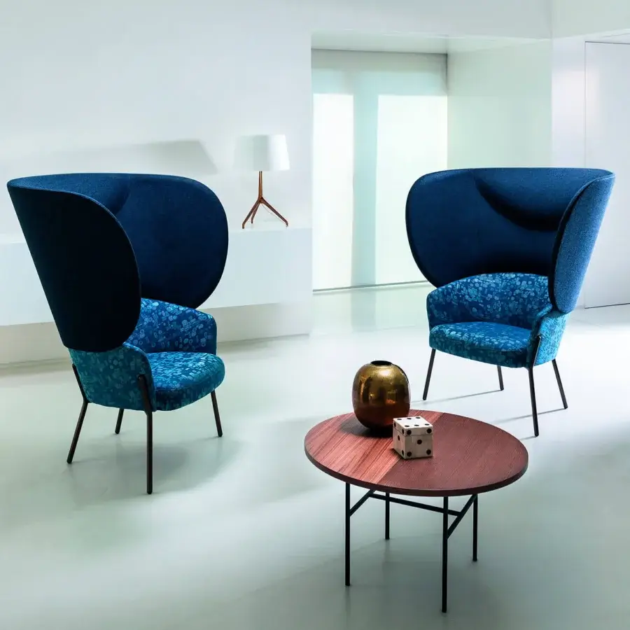 Exceptional Bross Wam lounge chair with metal frame and premium fabric upholstery in solid dark blue and patterned blue textile
