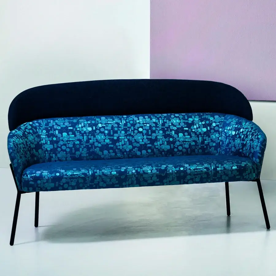 Superior Bross Wam sofa with patterned blue textile upholstery and sleek dark navy metal frame finish