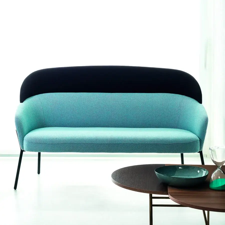 Distinguished Bross Wam sofa crafted in Italy with teal and dark fabric upholstery plus slender metal legs